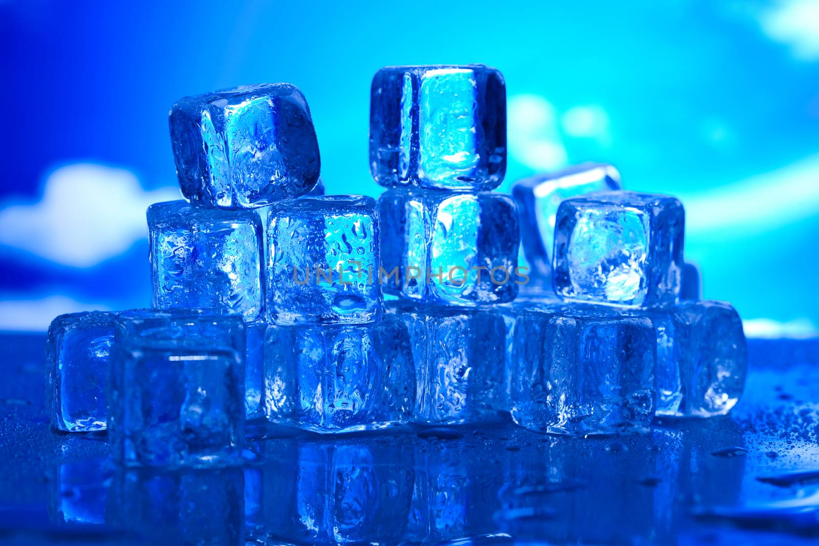 Ice cubes on blue background
