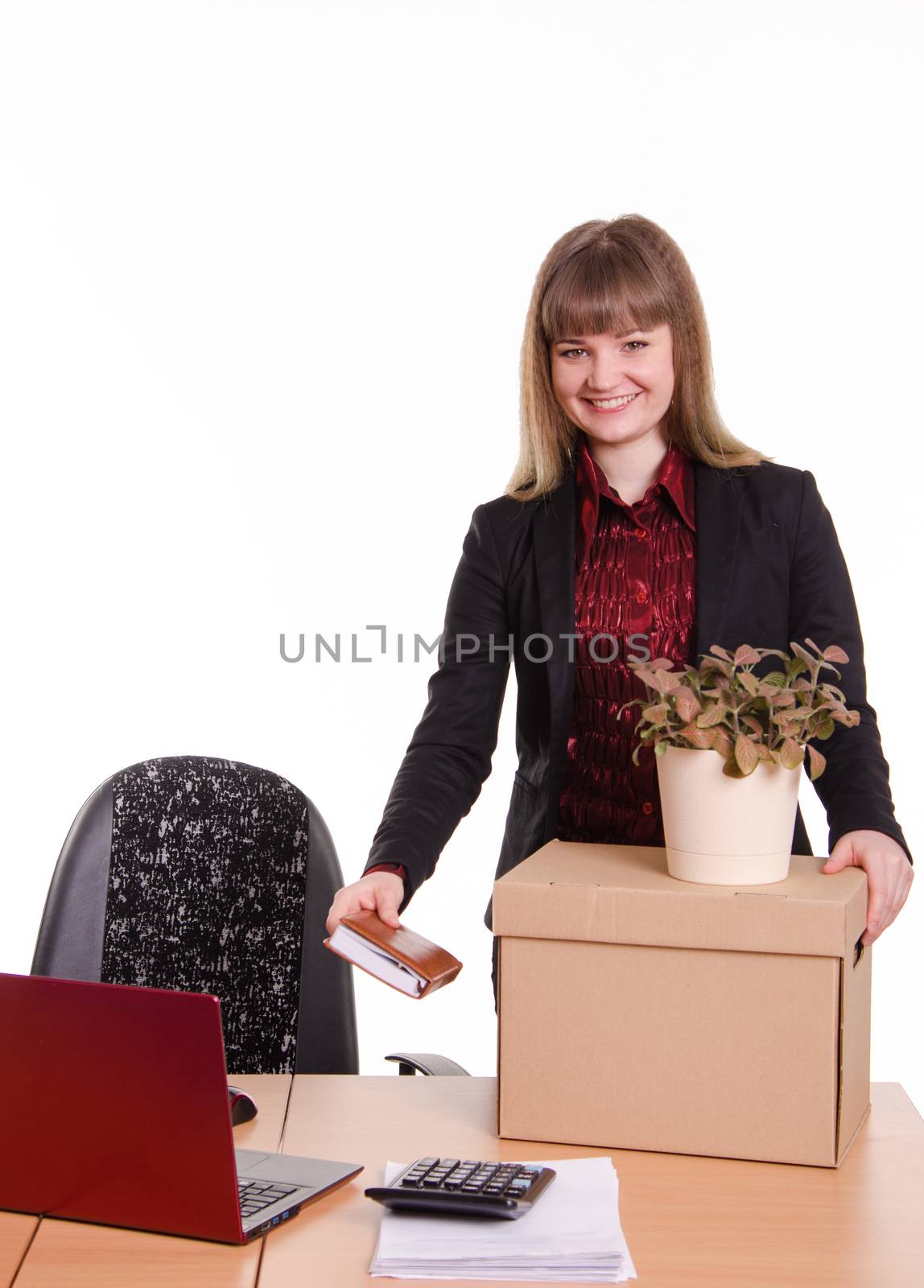 The girl accepted a job in an office holding a box with things