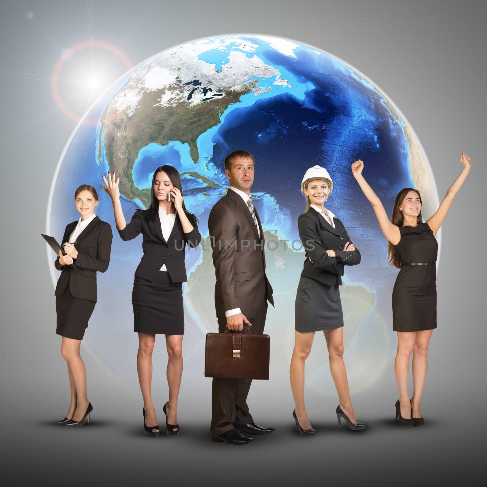 Business women and men in suits, smiling. Against background of globe earth by cherezoff