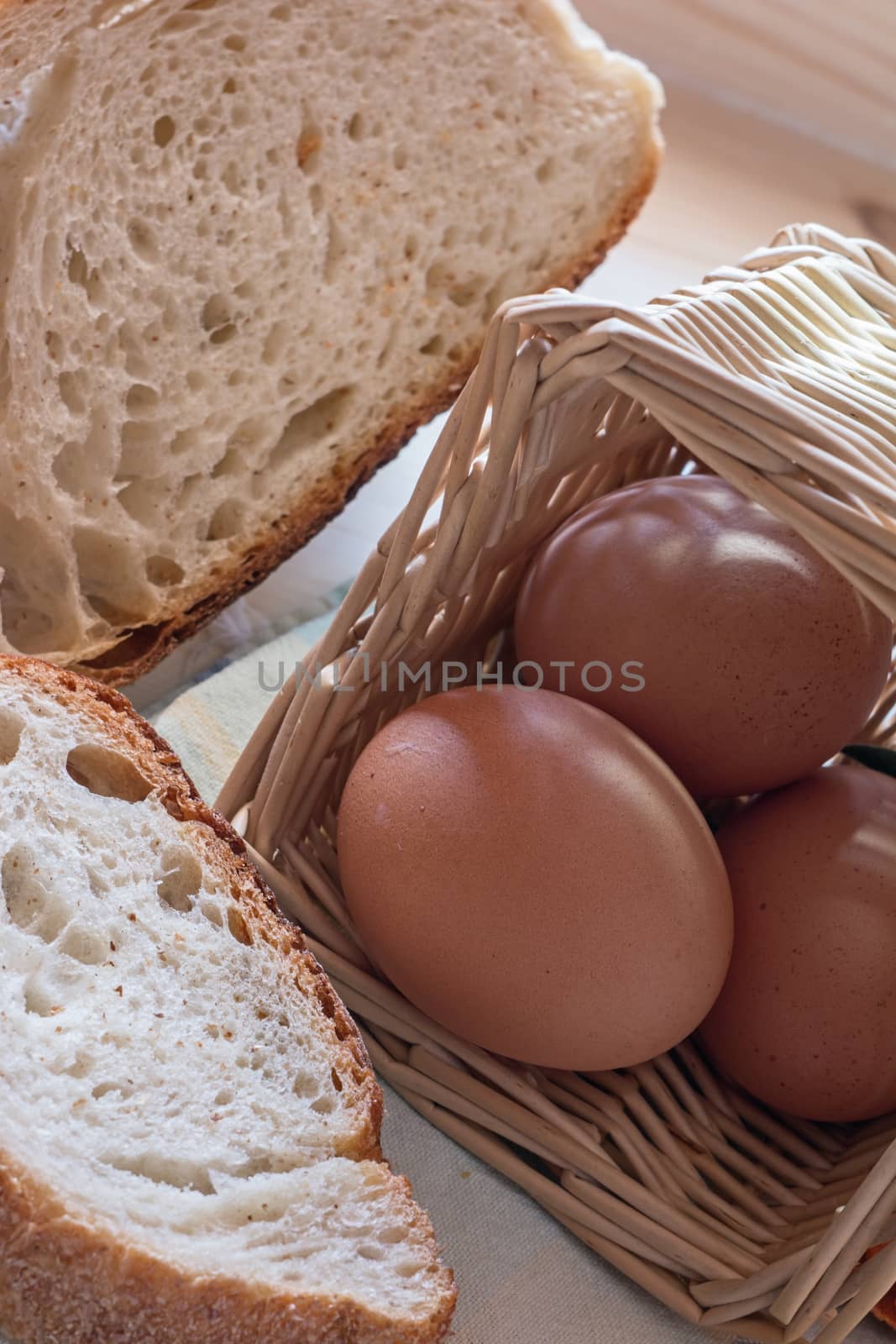 photograph depicting eggs in the basket and sliced bread