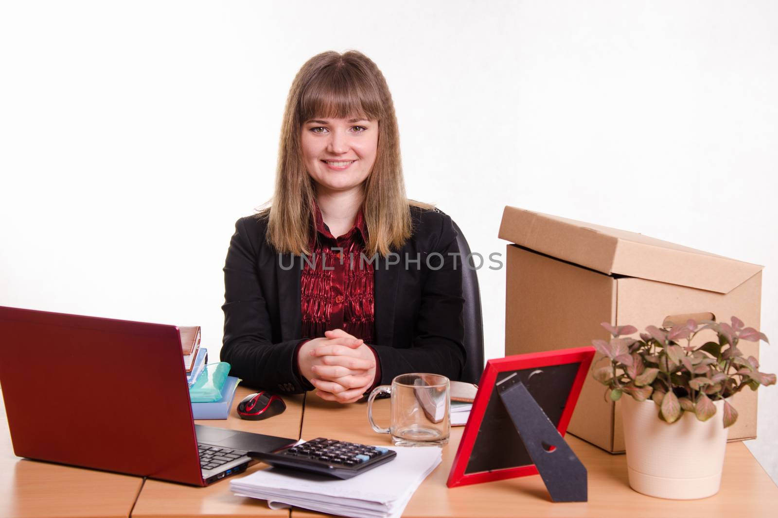 Cute business woman in the office at the computer