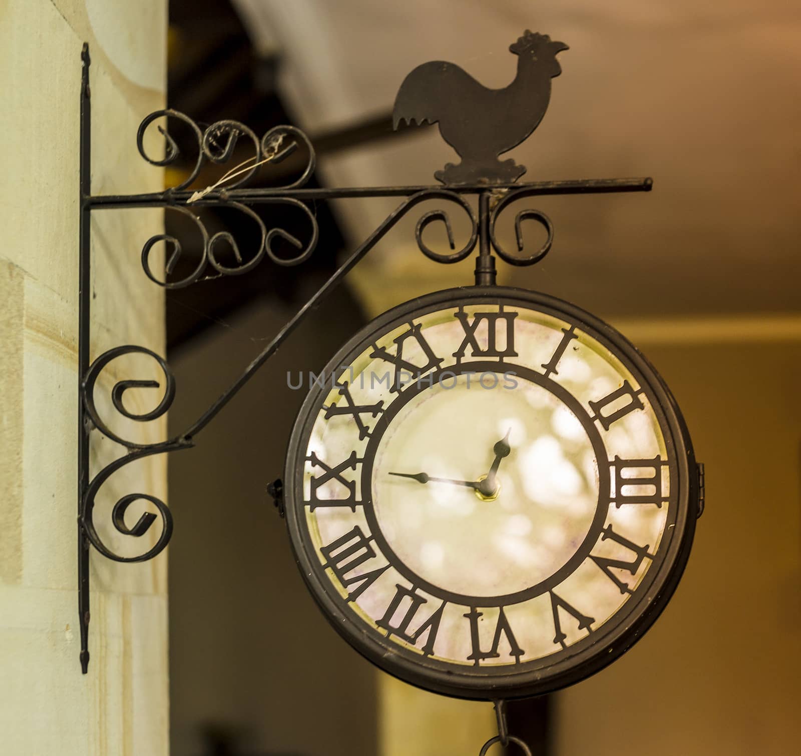 Photo of a Vintage Outdoor Chime with a Bell Hanging.