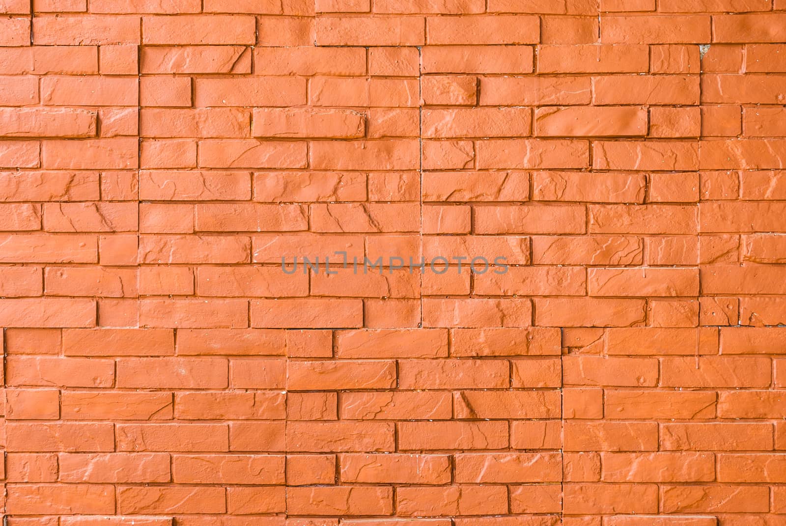 Orange Rough Brick Wall Background/ Texture.