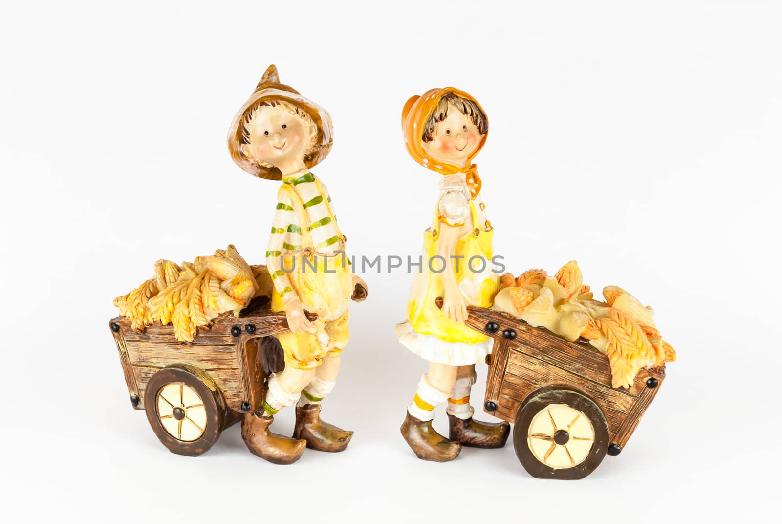 Boy and Girl Dolls with Corn Carts.