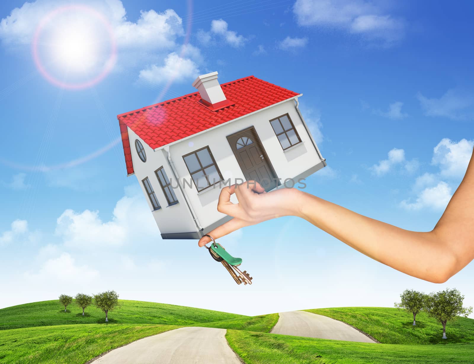 Hand holding house and bunch of keys. In the background, green hills with grass and roads. Blue sky