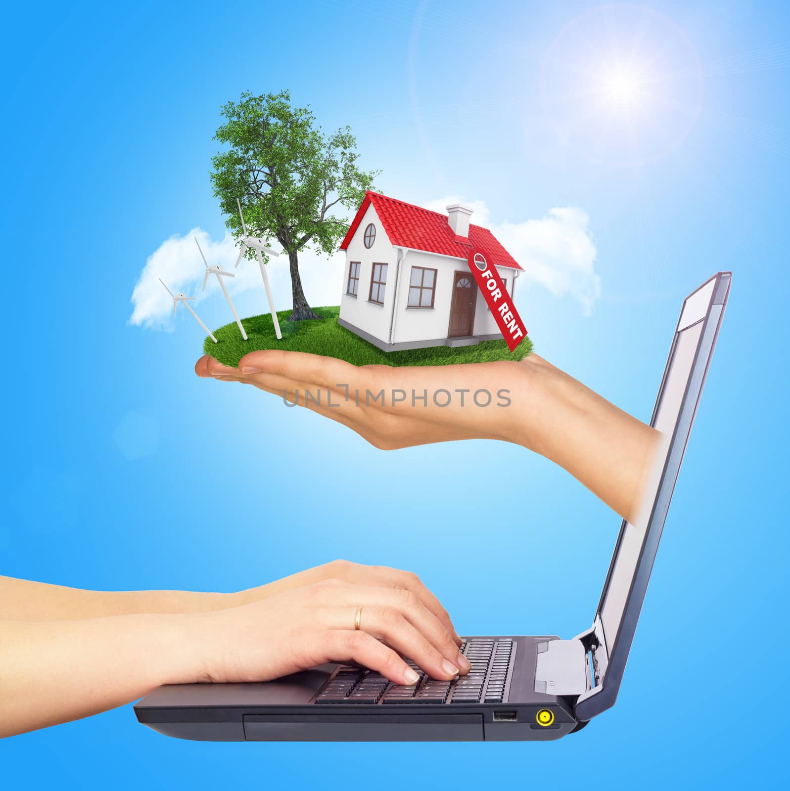 White shack in hand with red roof and chimney of screen laptop. Background sun shines brightly on right by cherezoff