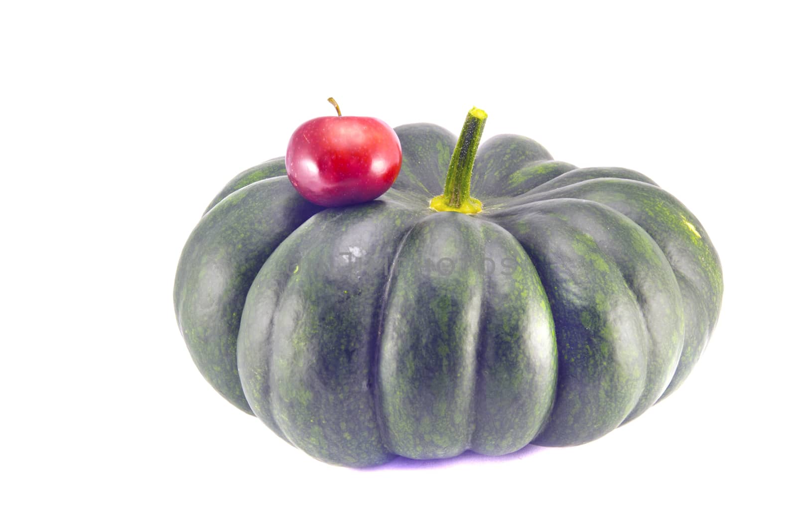 small and big - red apple and green pumpkin isolated on white