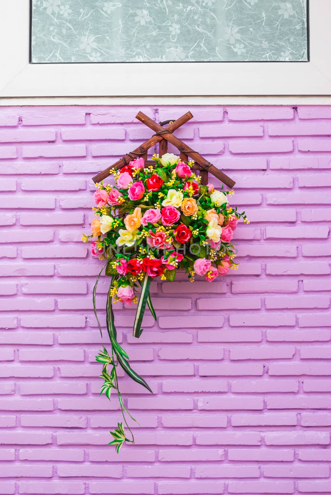 Roses on Purple Brick Wall.