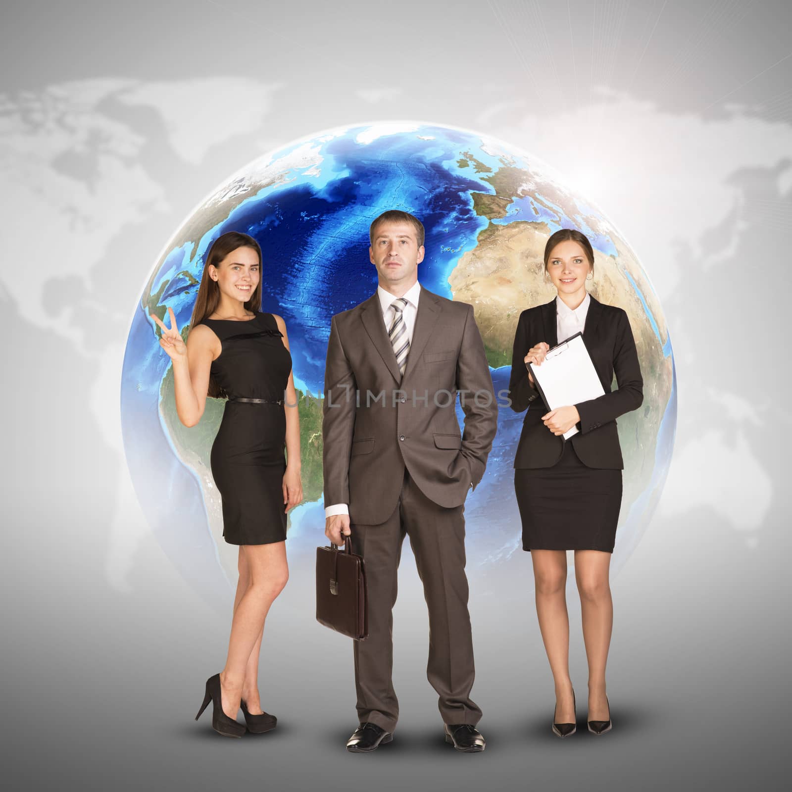 Business women and men in suits, smiling and looking at camera. Against the background of globe and world map. Elements of this image furnished by NASA