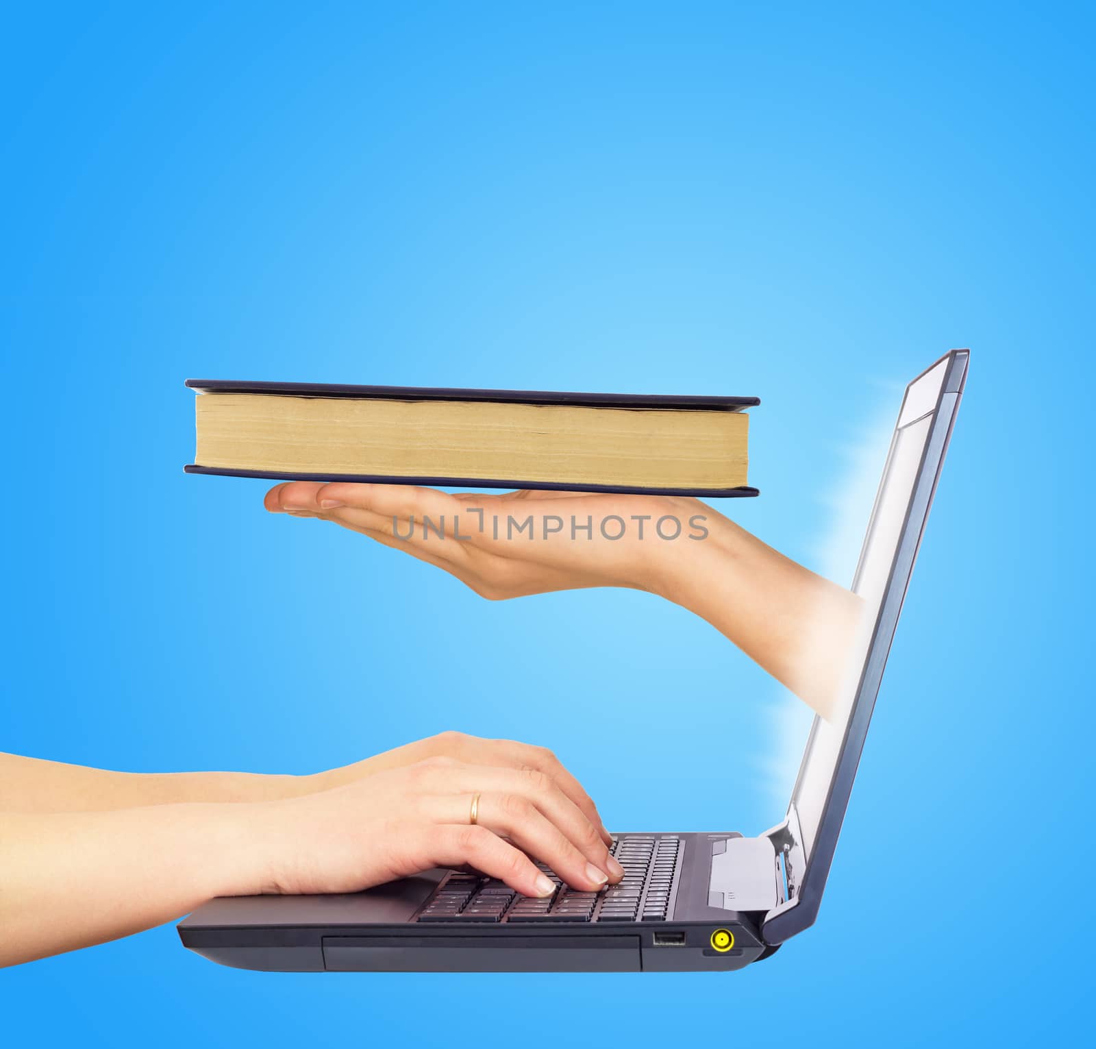 Book in hand from monitor screen. Hands typing on keyboard. Blue background