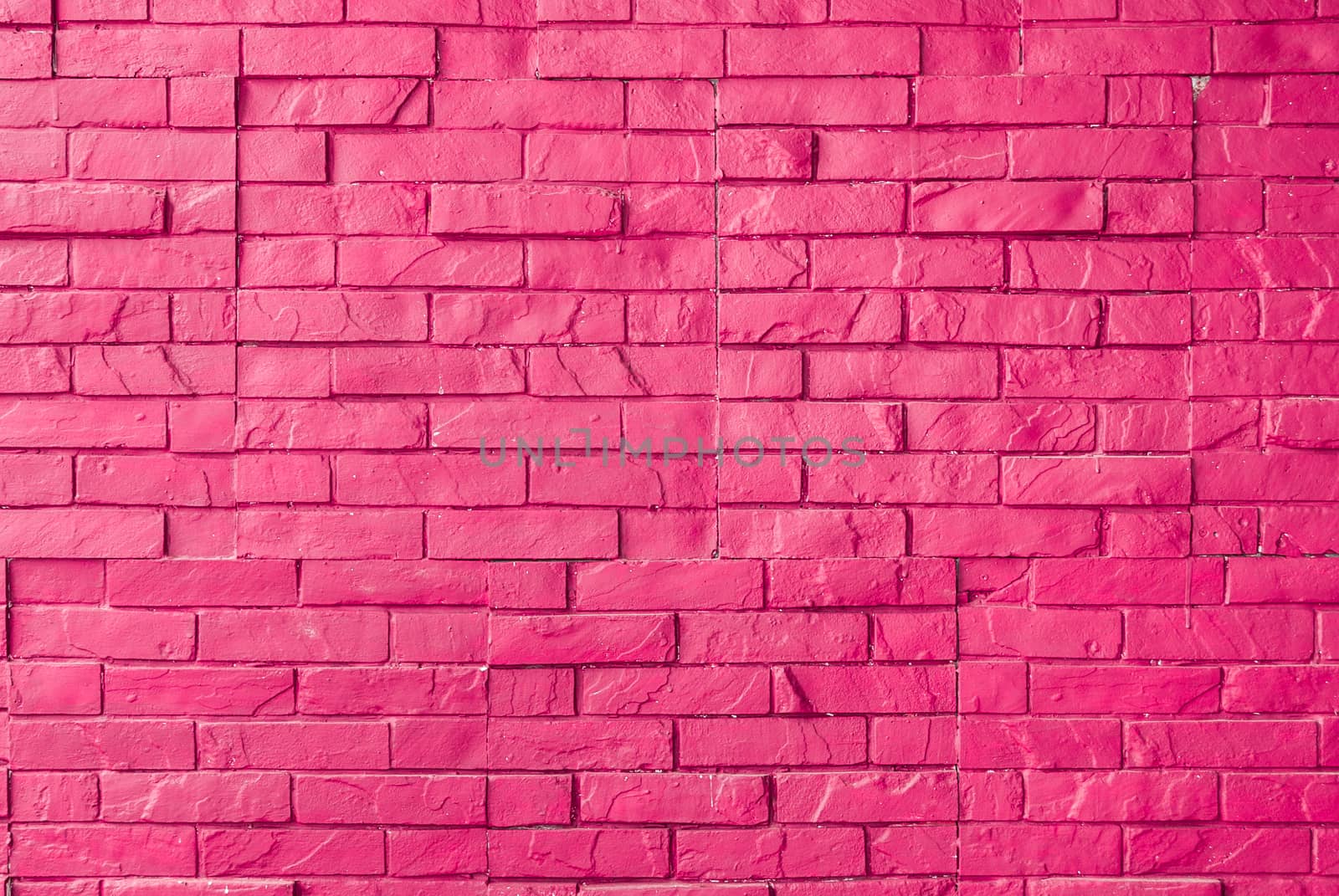 Magenta Rough Brick Wall Background/ Texture.