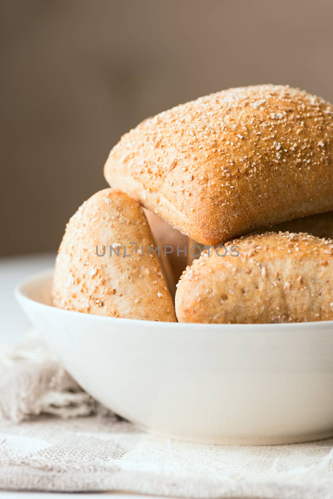 Oven baked bread in bowl. Selective focus. Shallow DOF