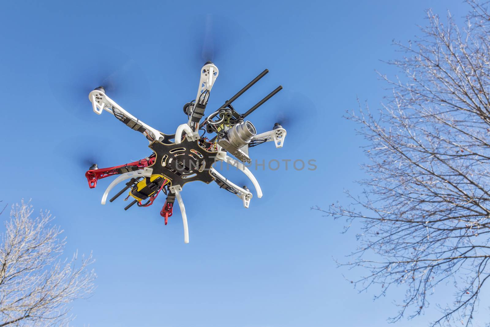 hexacopter drone flying with camera by PixelsAway