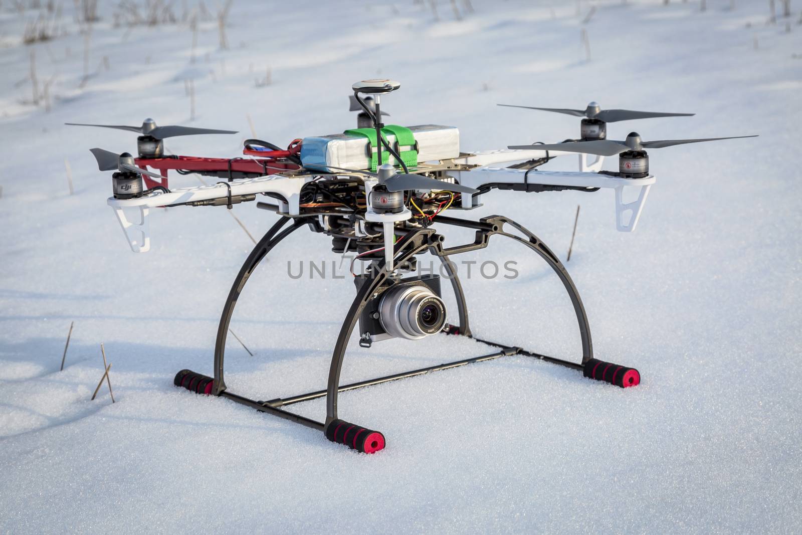 FORT COLLINS, CO, USA, March 9,  2015:  DJI F550 Flame Wheel  hexacopter drone just landed on a snow covered field.