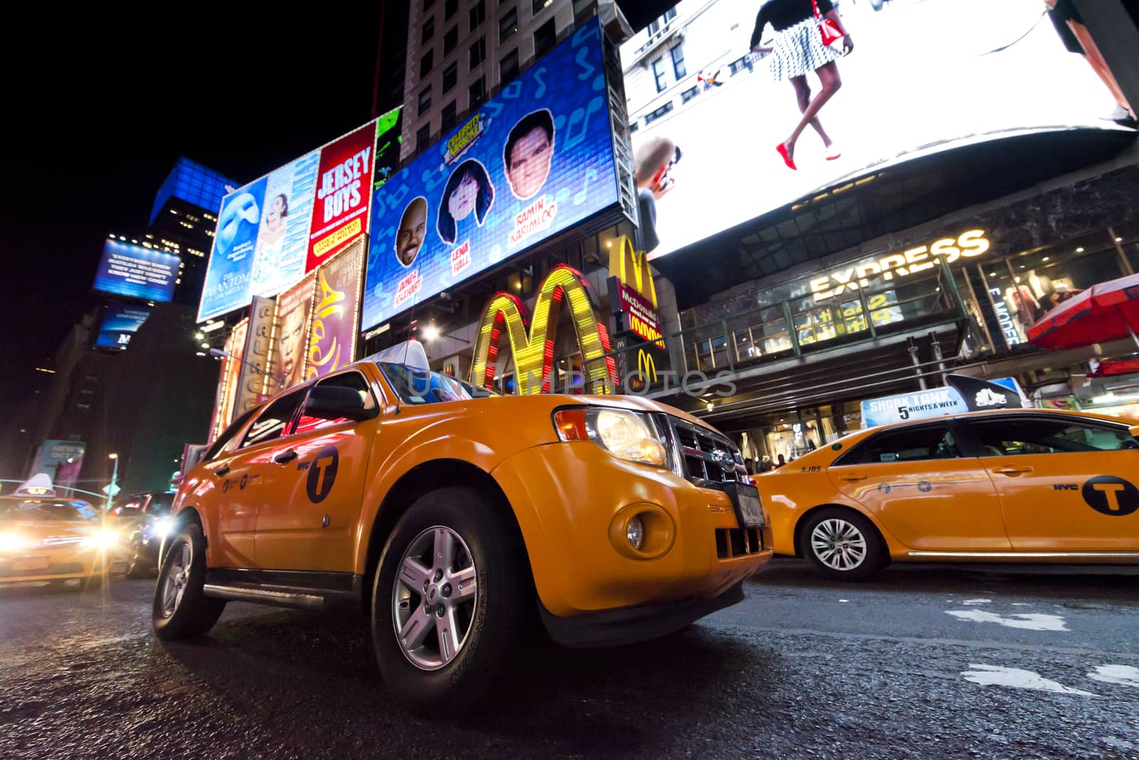 New York City, USA - October 4, 2014 : Times Square, featured with Broadway Theaters, Taxi Cabs and animated LED signs, is a symbol of New York City and the United States.