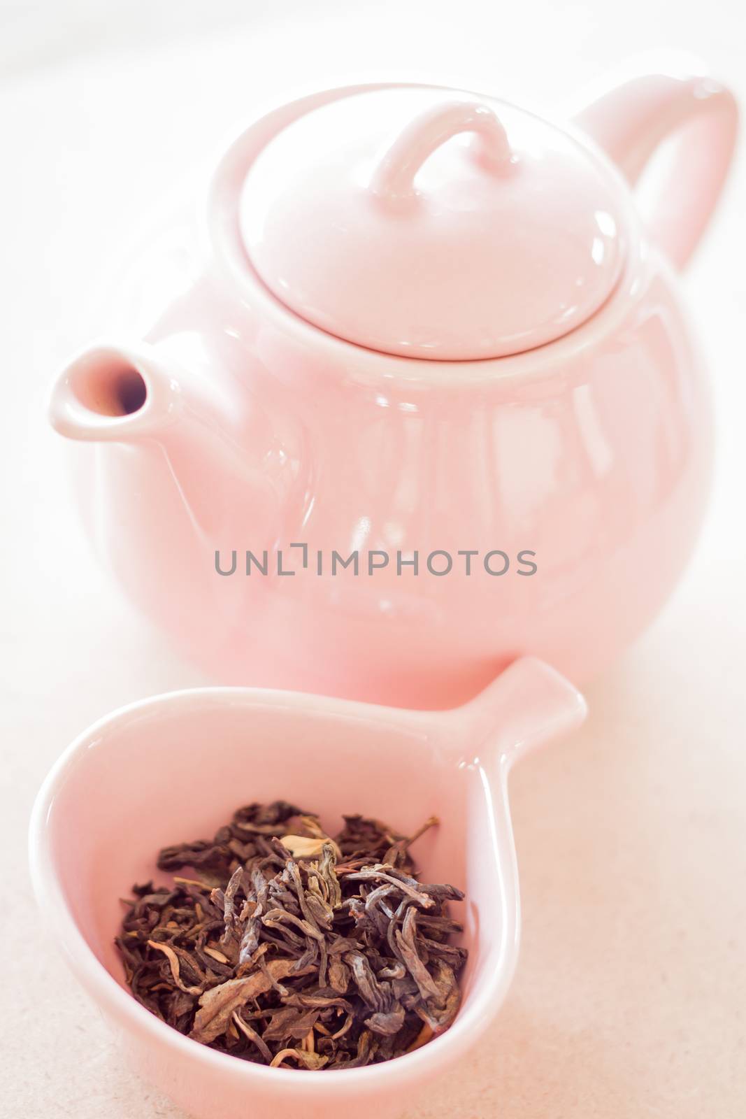 Oolong tea in ceramic cup and jar by punsayaporn