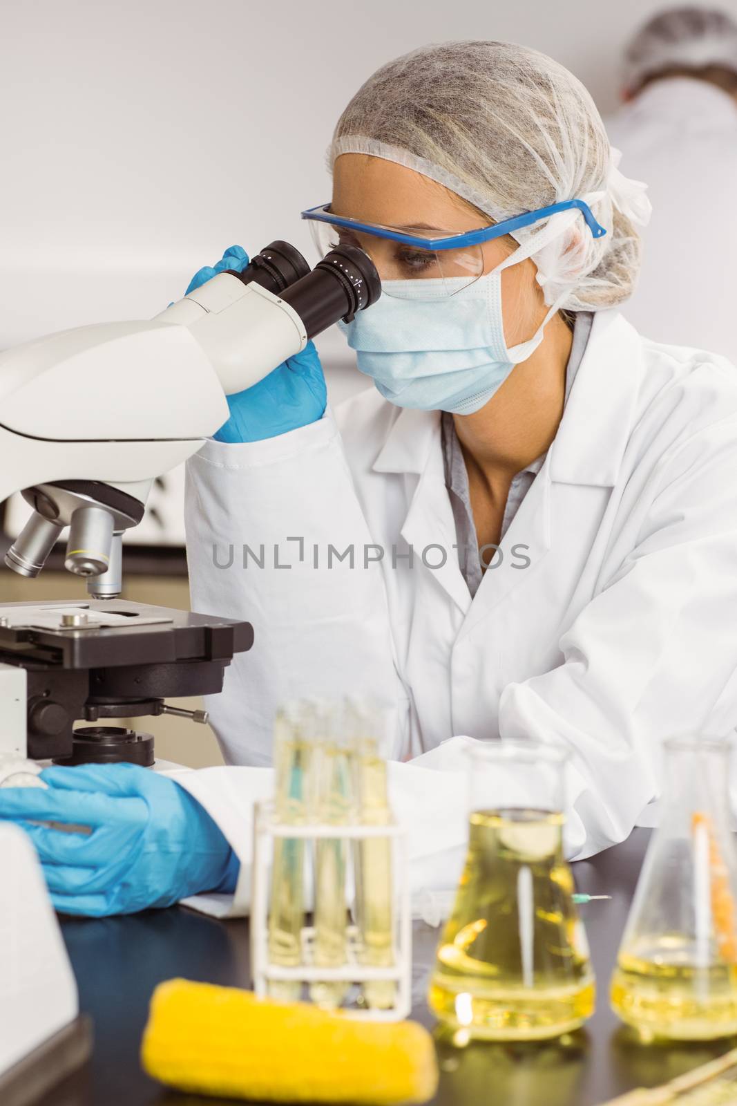 Food scientist using the microscope at the university