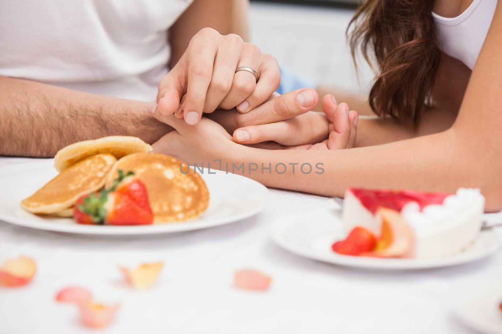 Close up of young couple having a romantic breakfast by Wavebreakmedia