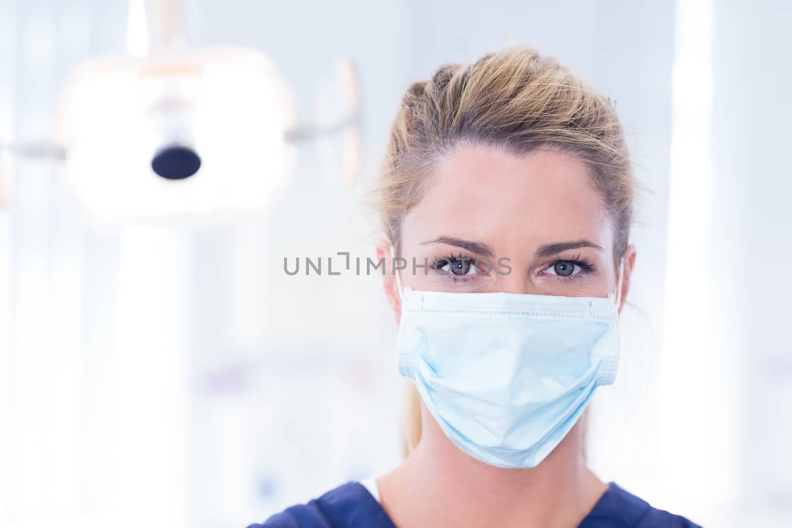 Portrait of a dentist in mask looking at camera by Wavebreakmedia