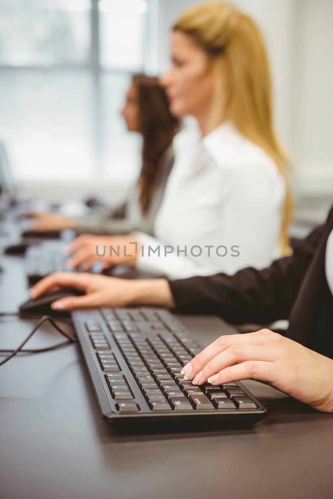 Close up of a businesswoman typing on keyboard in the office