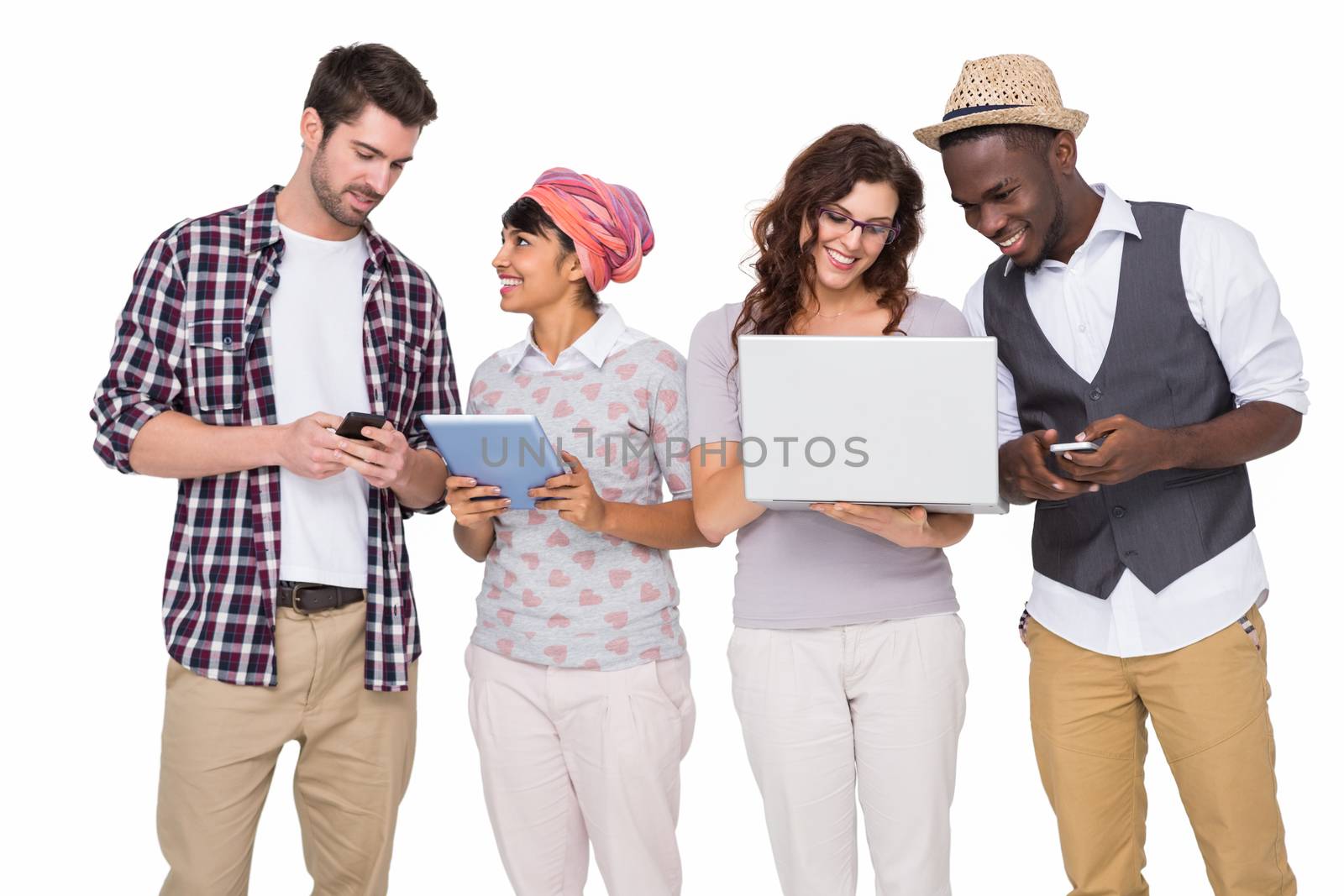 Smiling coworkers with technology interacting together on white background