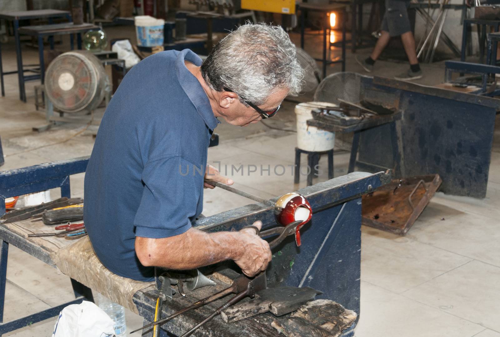 glass blower in city Mdina on the island Malta by compuinfoto