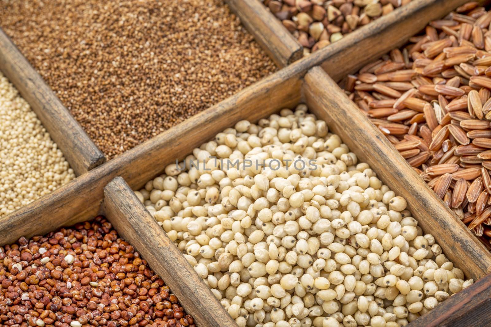 sorghum and other gluten free grains in a wooden rustic box