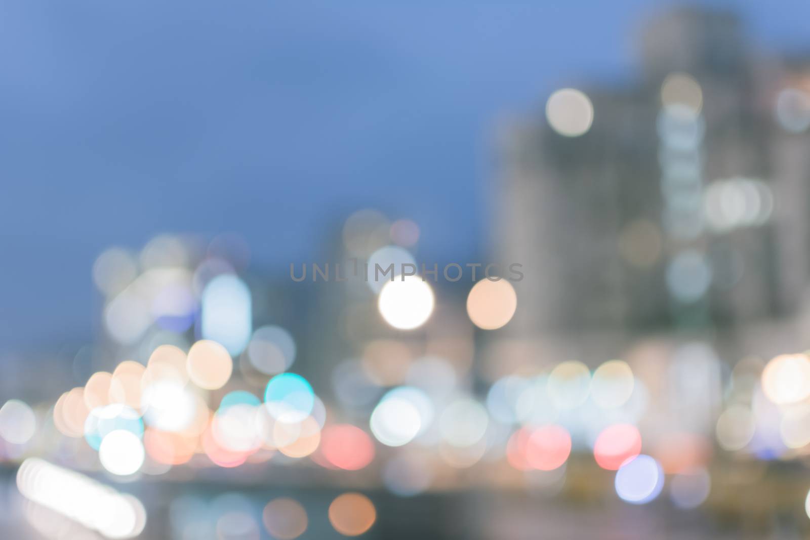Abstract urban background with blurred buildings and street, shallow depth of focus.