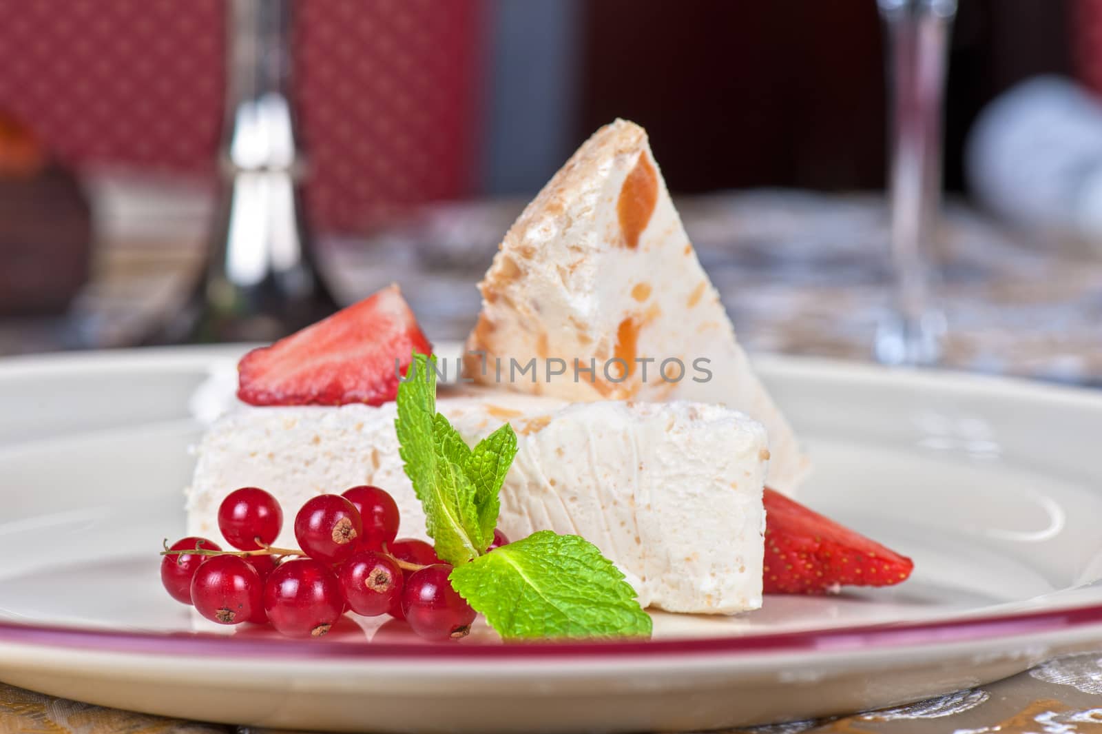 cream dessert with berries cranberries and strawberry