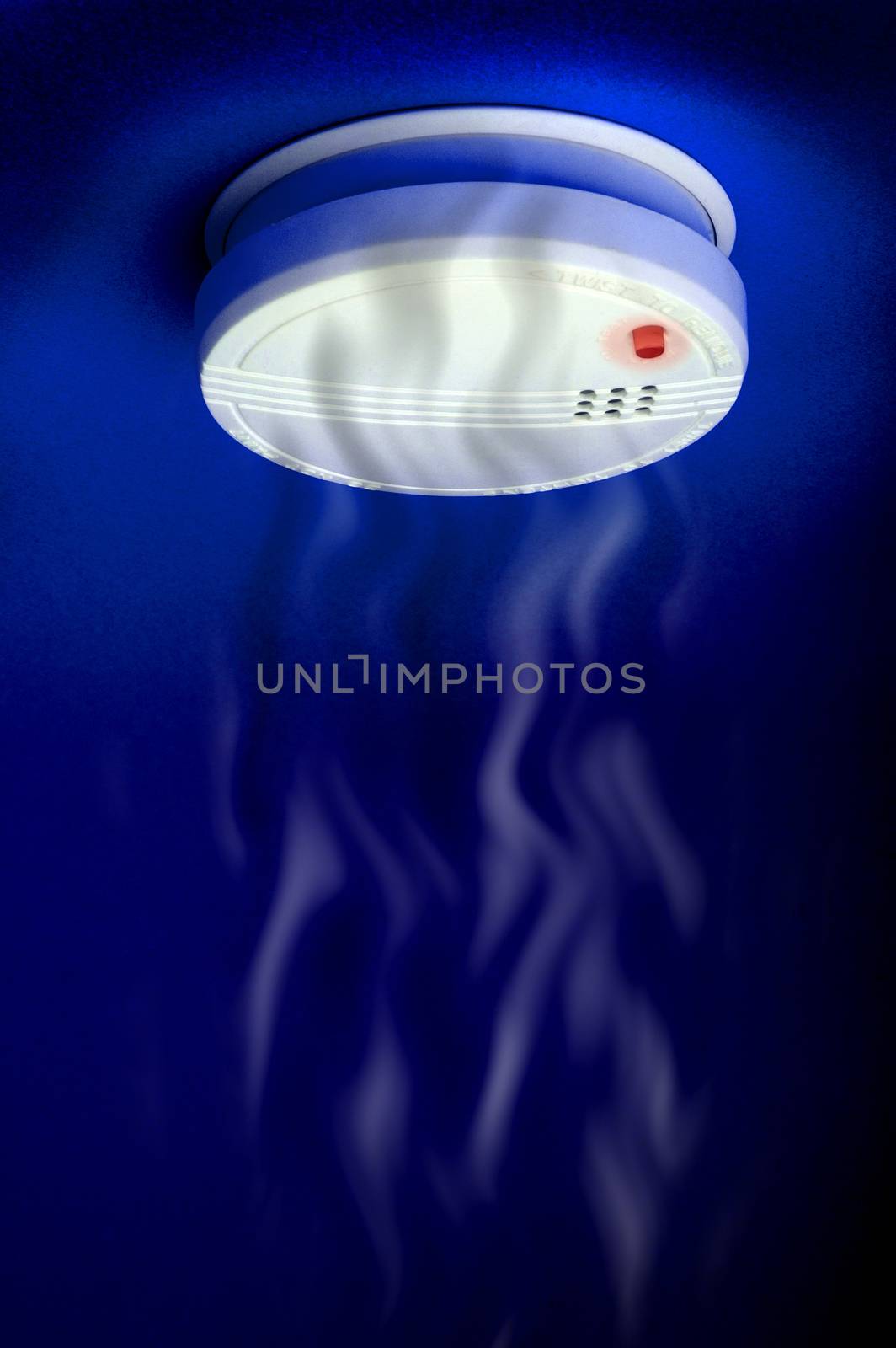 smoke detector with smoke and red light on the dark blue background