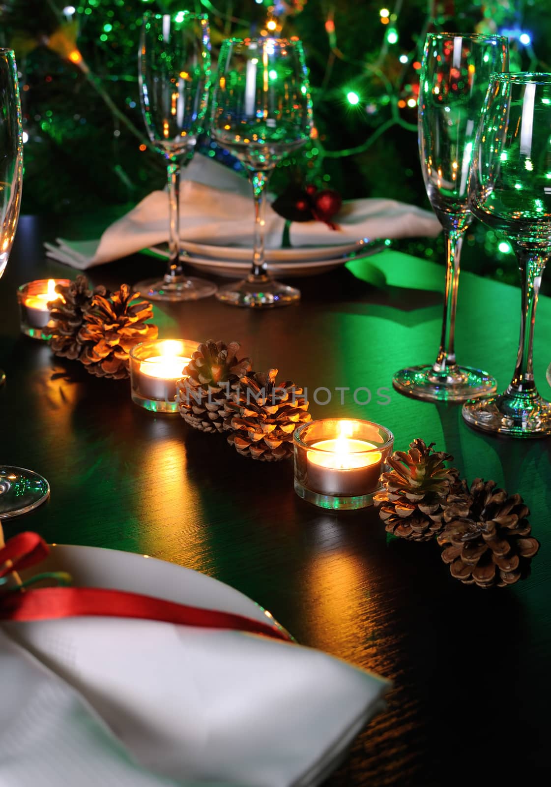 Candle and cones as an element of decor Christmas table