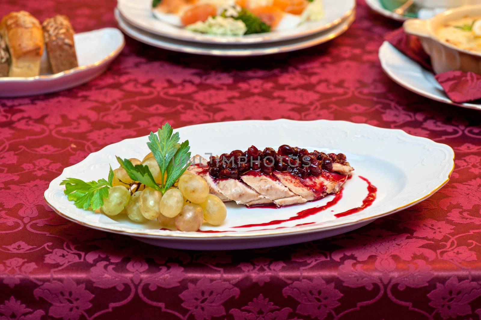 chicken breast meat with cranberry sauce
