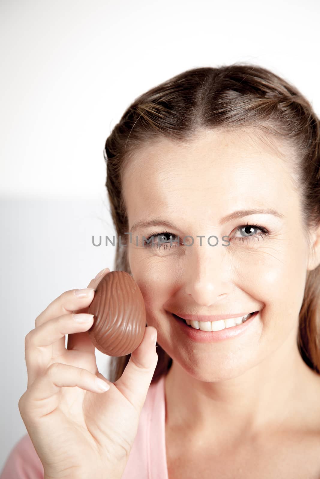 20-25, background, caucasian, decoration, easter, egg, event, felicity, female, giving, hand, handmade, happy, holding, hope, human, life, model, old, one, palm, people, person, portrait, property, releases, seasonal, show, showing, smile, smiling, studio, symbol, traditional, white, woman, years, young