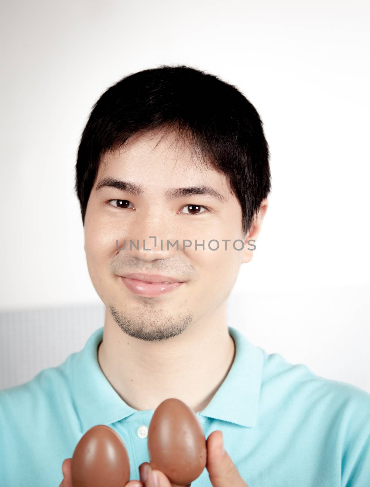 20-25, asian, background, caucasian, decoration, easter, egg, event, felicity, giving, hand, handmade, happy, holding, hope, human, life, male, man, model, old, one, palm, people, person, portrait, property, releases, seasonal, show, showing, smile, smiling, studio, symbol, traditional, white, years, young