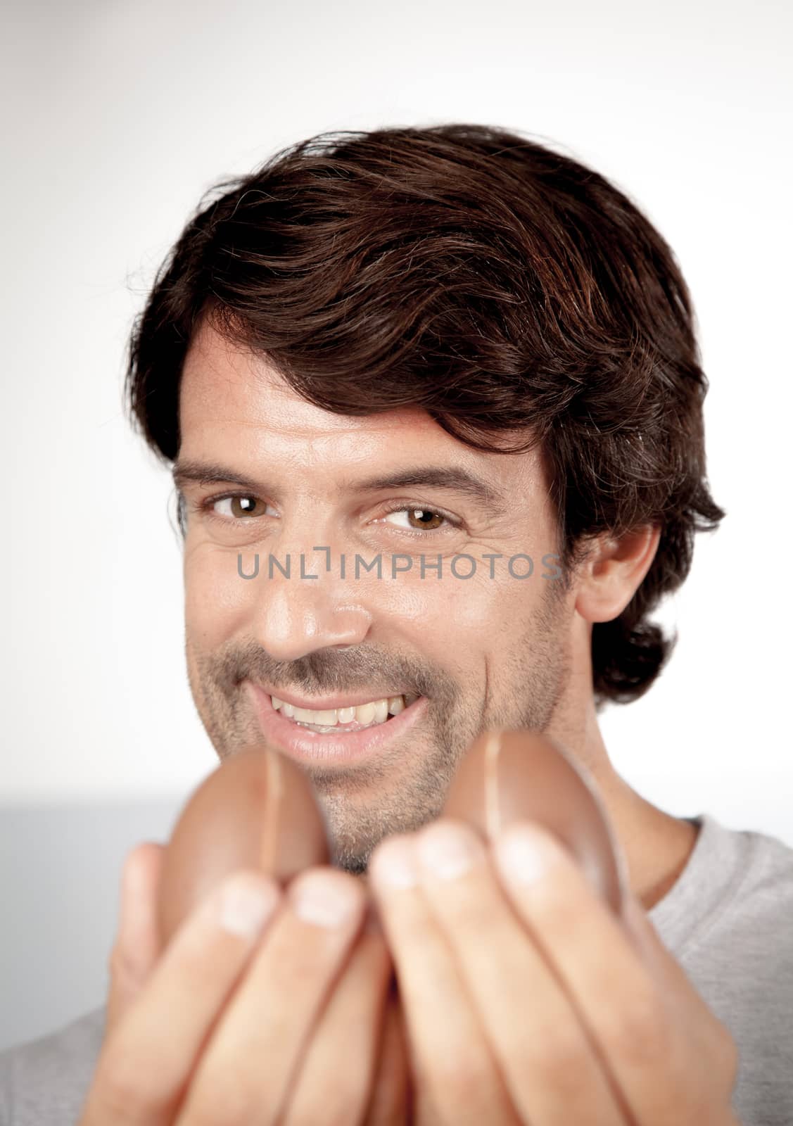 25-30, background, caucasian, decoration, easter, egg, event, felicity, giving, hand, handmade, happy, holding, hope, human, life, male, man, model, old, one, palm, people, person, portrait, property, releases, seasonal, show, showing, smile, smiling, studio, symbol, traditional, white, years, young