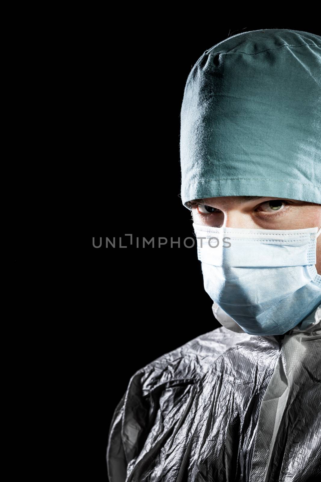 Freaky Doctor looking at the camera Isolated over  Black Background