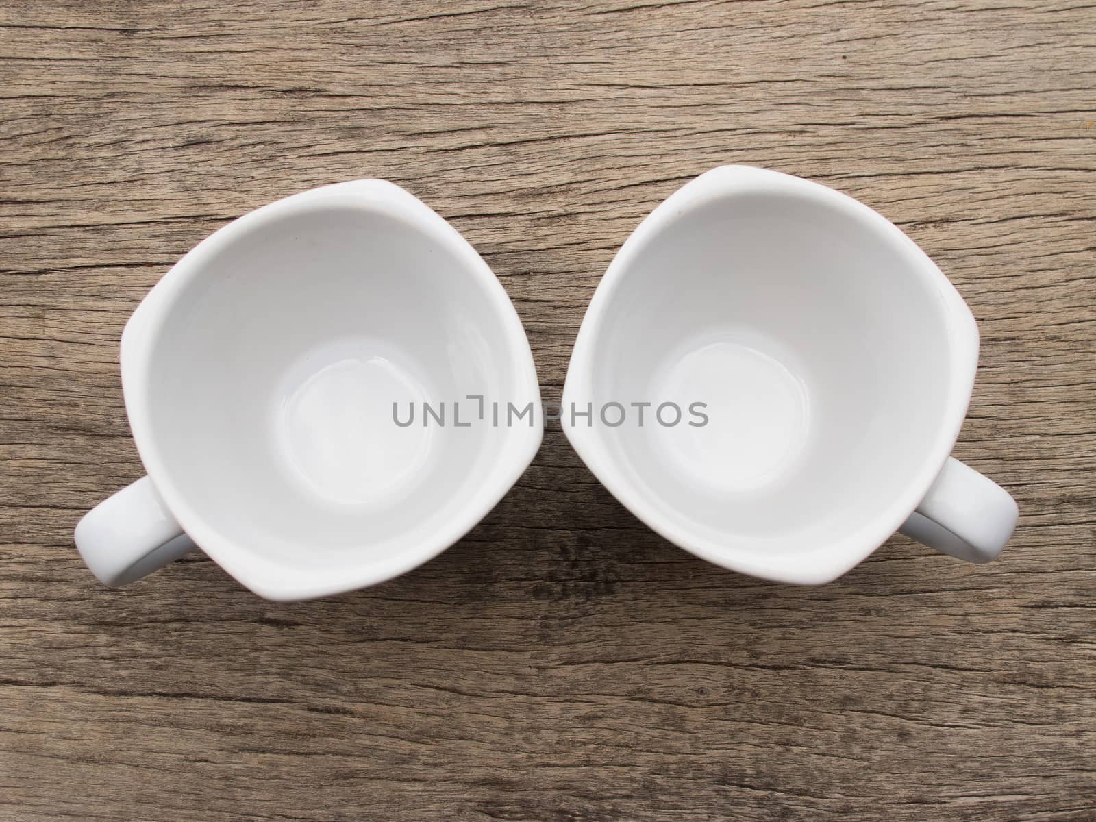 Blank white teacup on wood by iampuay