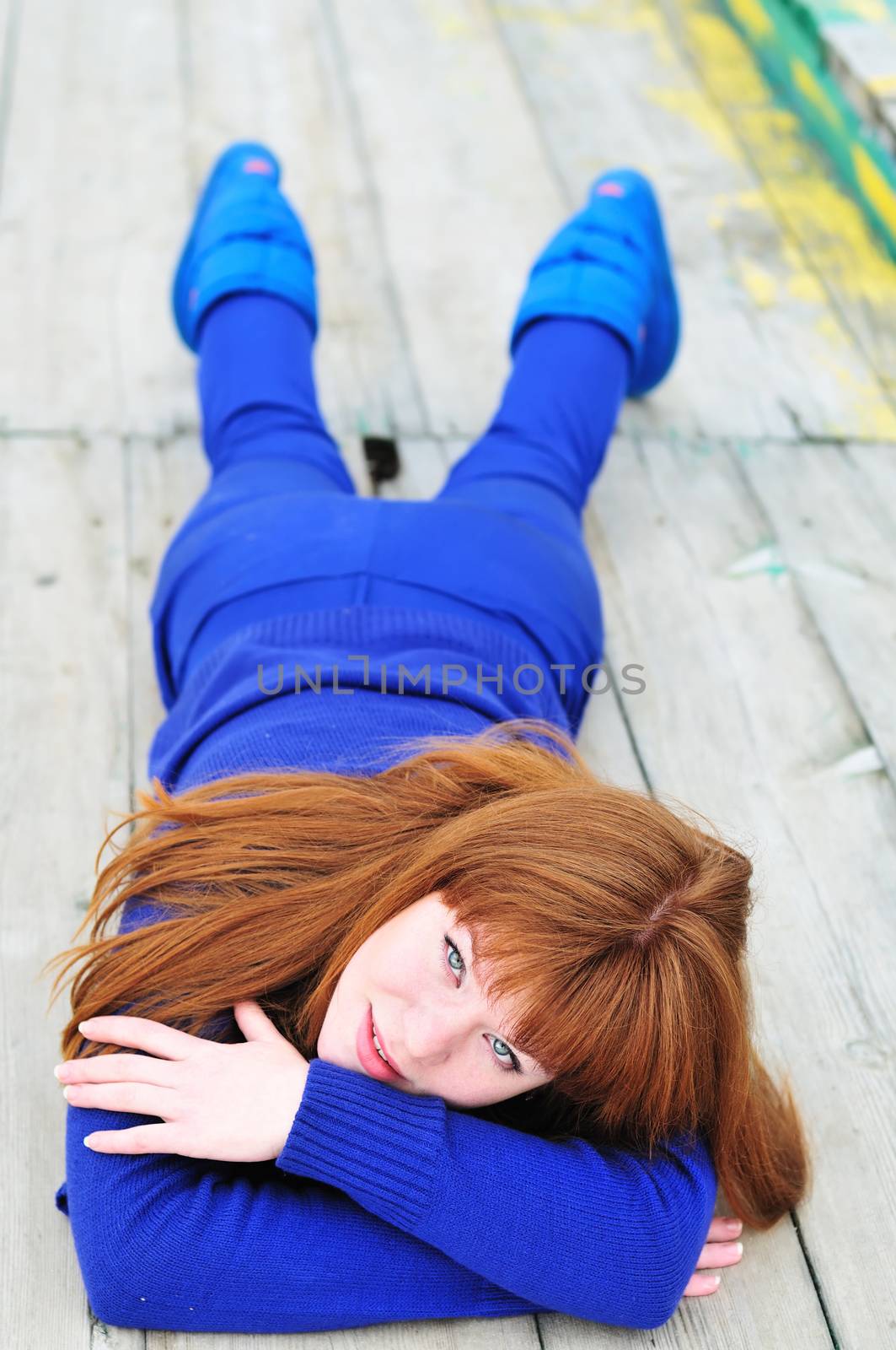 laying redheaded girl by Reana