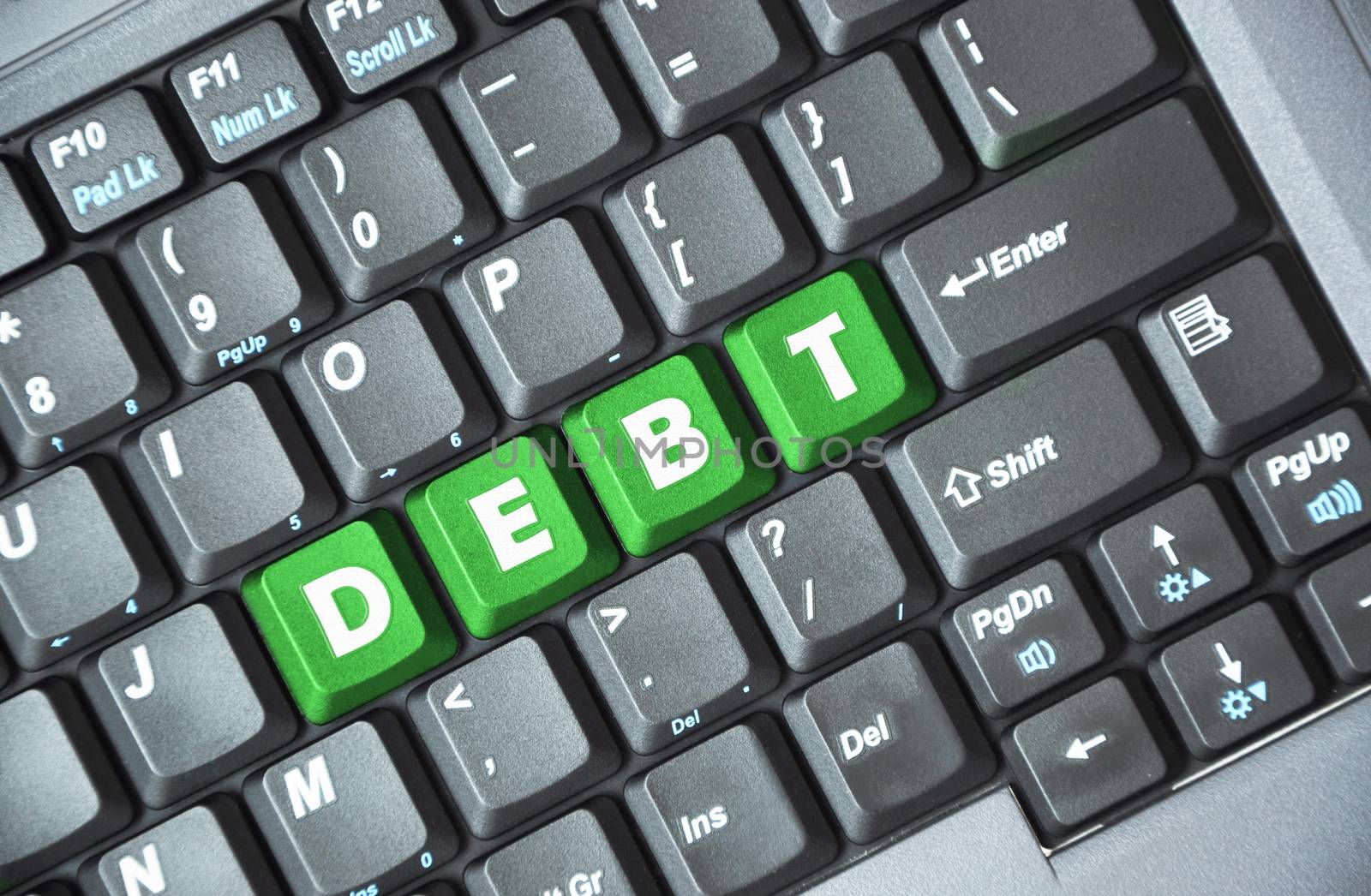 Green debt key on keyboard