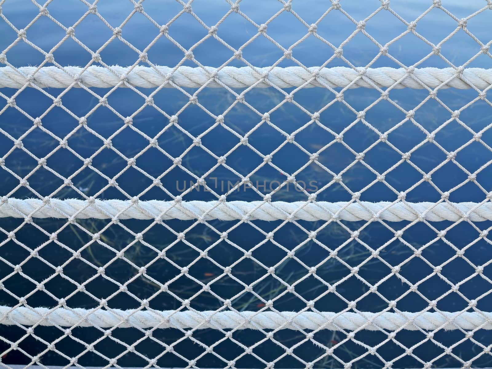 Rope and Net pattern with a lake behind