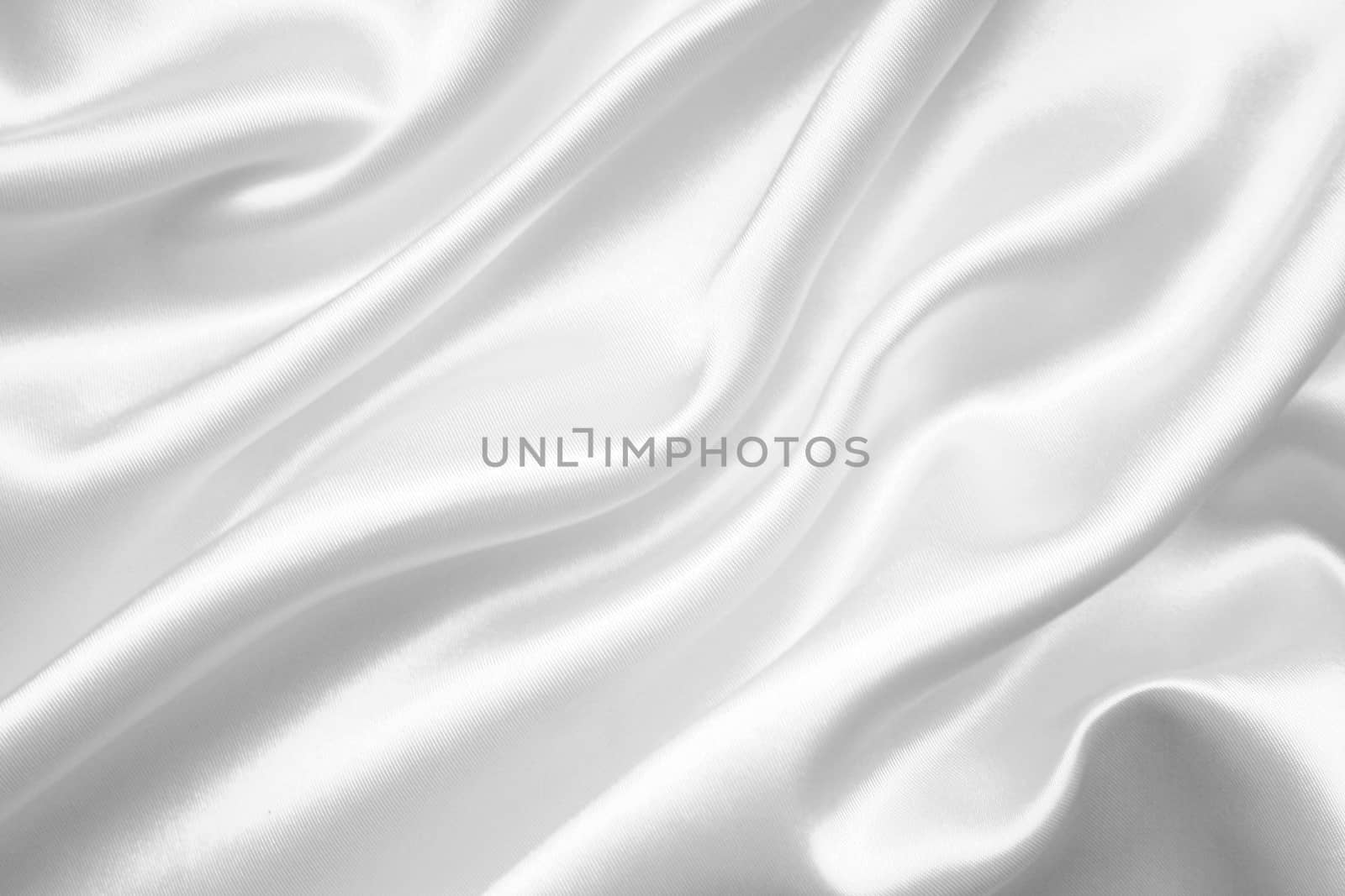 Smooth elegant white silk or satin can use as wedding background 