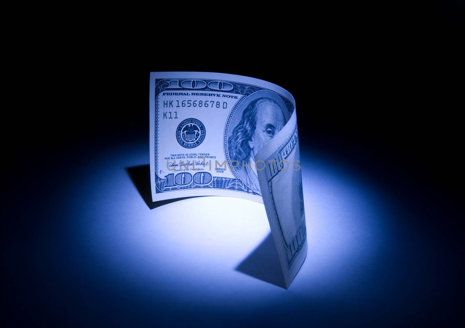 Hundred dollars. 
Beautiful art illumination. A dark blue background.