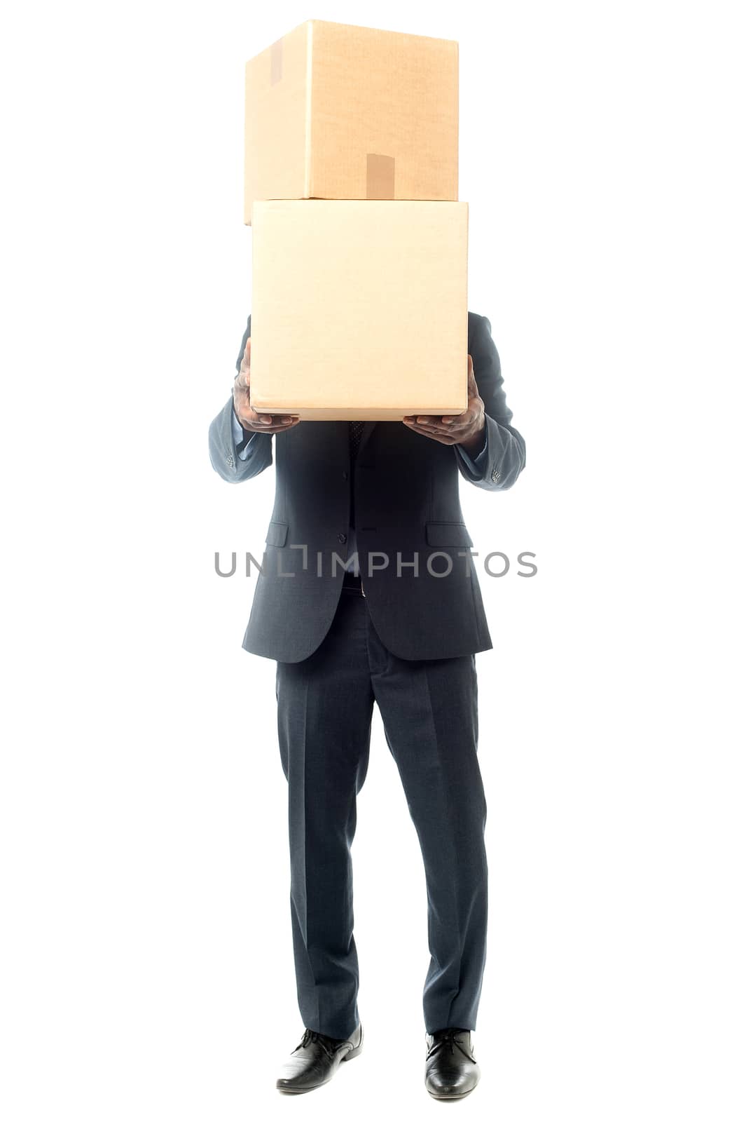 corporate man holding stack of boxes