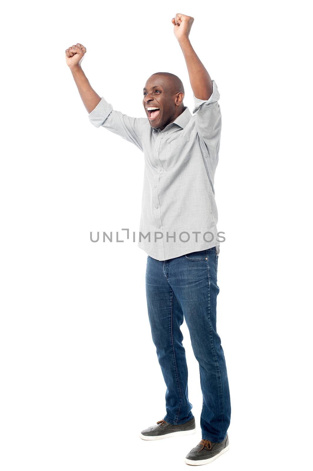 Happy man celebrating his success by stockyimages