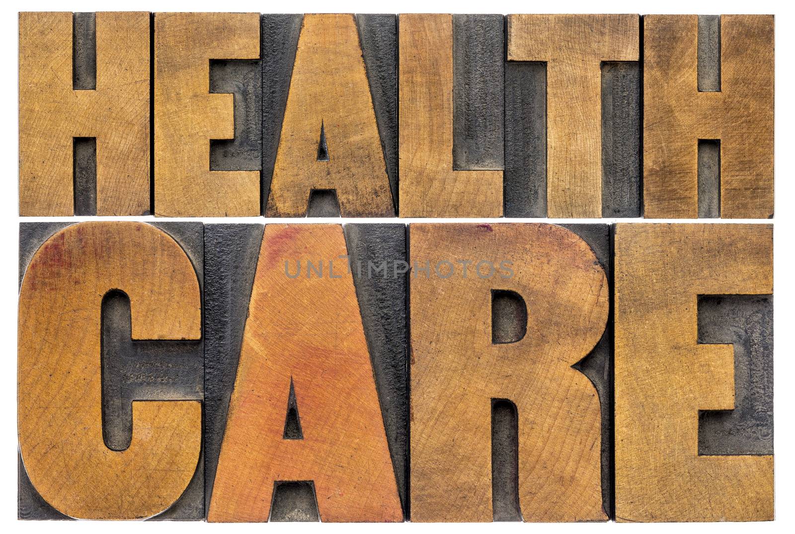 healthcare word abstract in wood type by PixelsAway