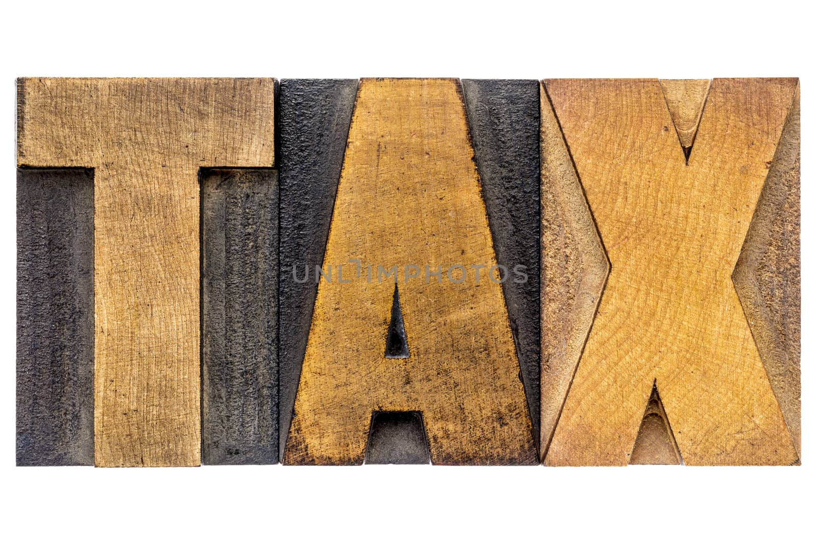 tax word in wood type by PixelsAway