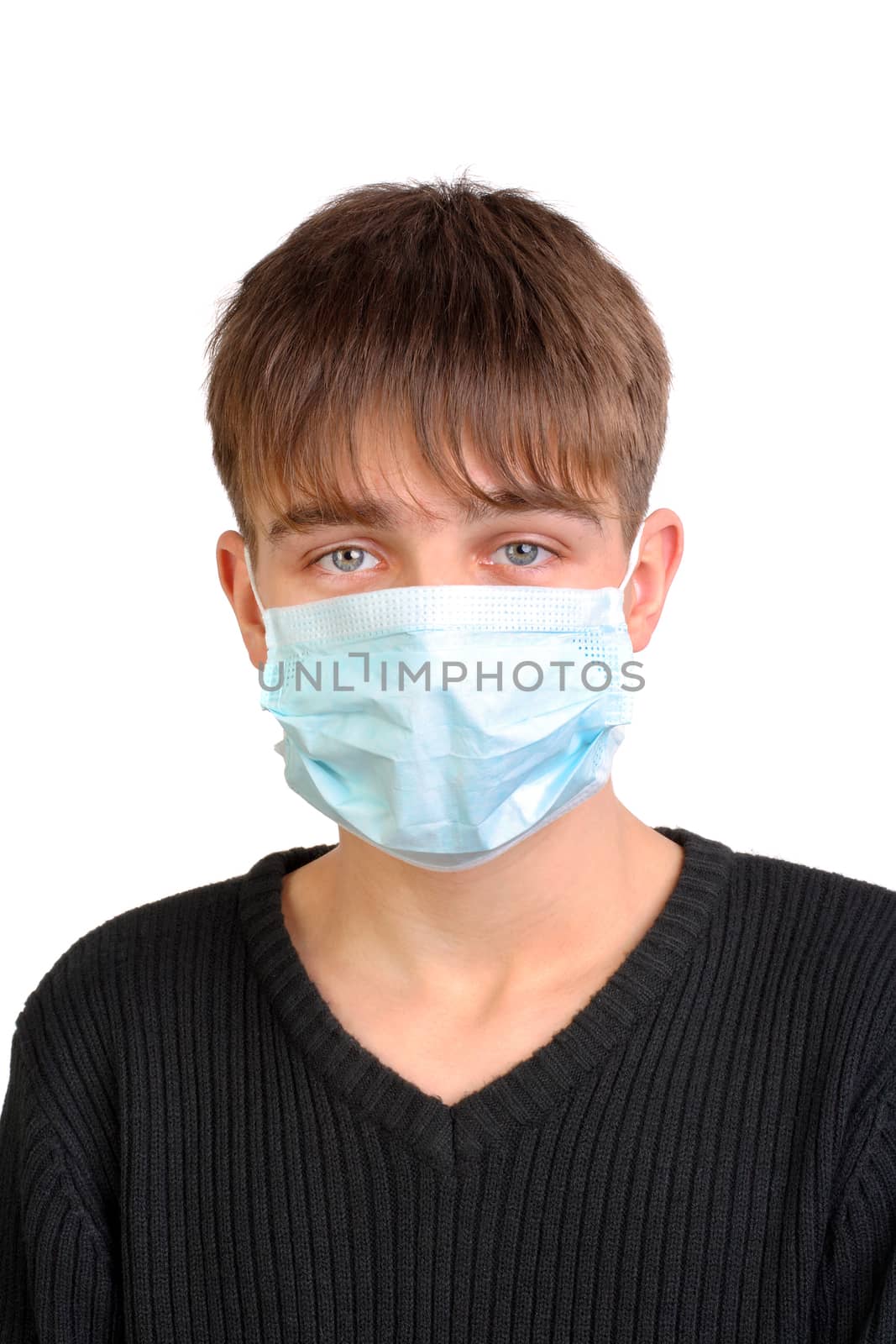 Sad Teenager in Flu Mask on the White Background