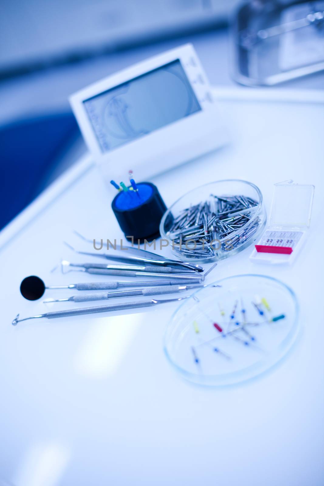 Dental instruments and tools in a dentists office by JanPietruszka