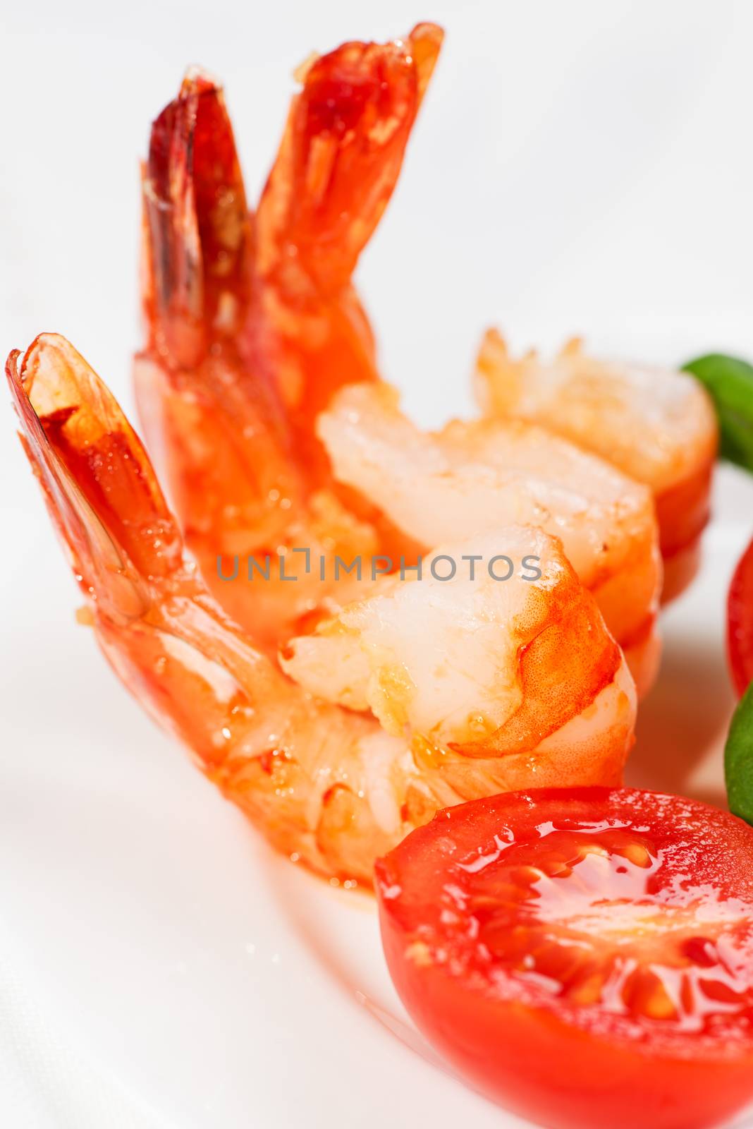 Fried shrimp and tomato close up by Nanisimova