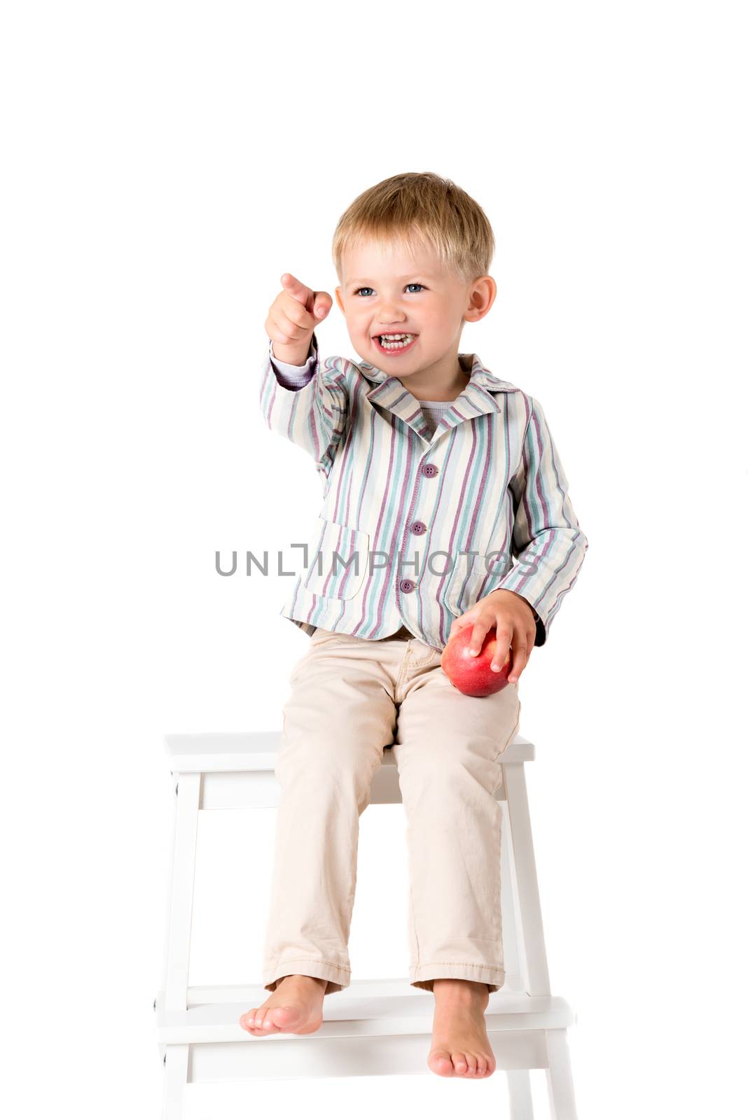 Boy shot in the studio on a white background pointing by Nanisimova